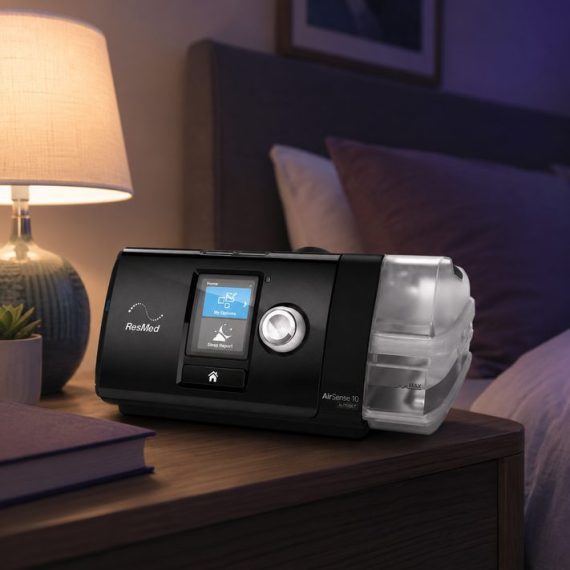 ResMed AirSense 10 on a bedside nightstand during sleep therapy