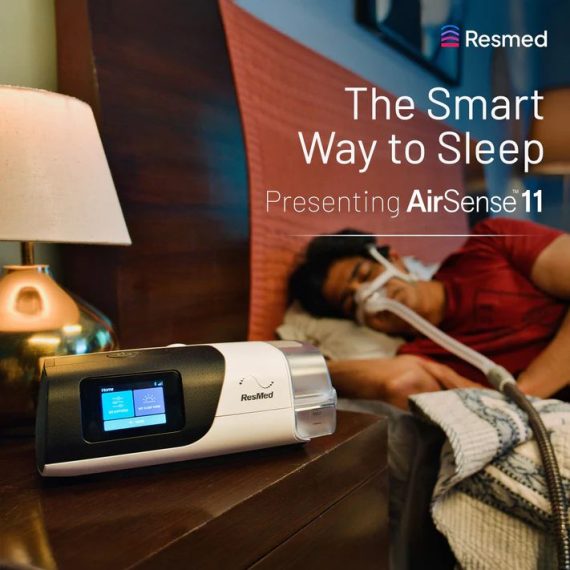 ResMed AirSense 11 on a bedside nightstand during sleep therapy