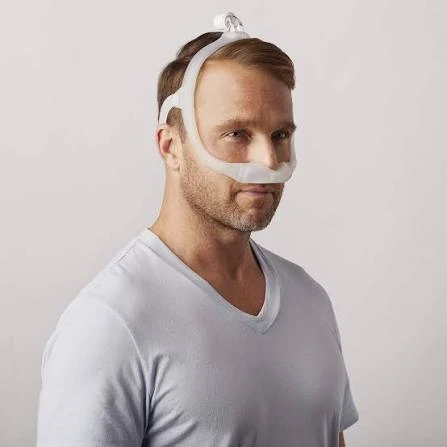 Man wearing the assembled Philips DreamWear nasal mask and headgear, side profile