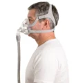 Man wearing ResMed AirFit F20 mask, rear side profile showing headgear strap routing