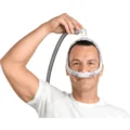 resmed-airfit-p30i-standard-man-holding-tube-lifestyle_1000x1000