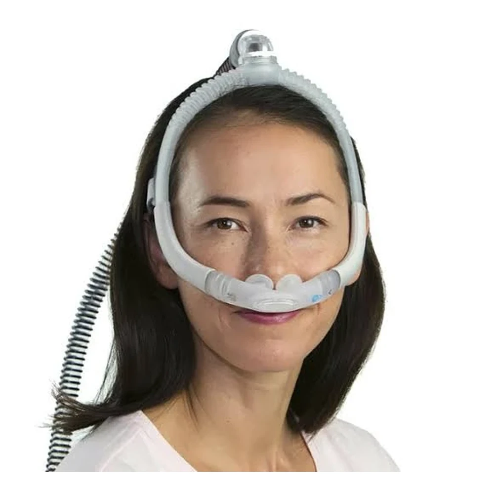Woman wearing ResMed AirFit P30i nasal pillow mask, front portrait