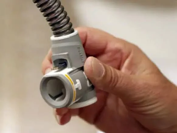 Close-up of the ResMed ClimateLineAir heated tubing elbow connector