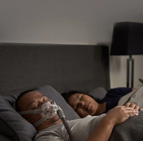 Person wearing the ResMed AirFit F30 full face mask while sleeping